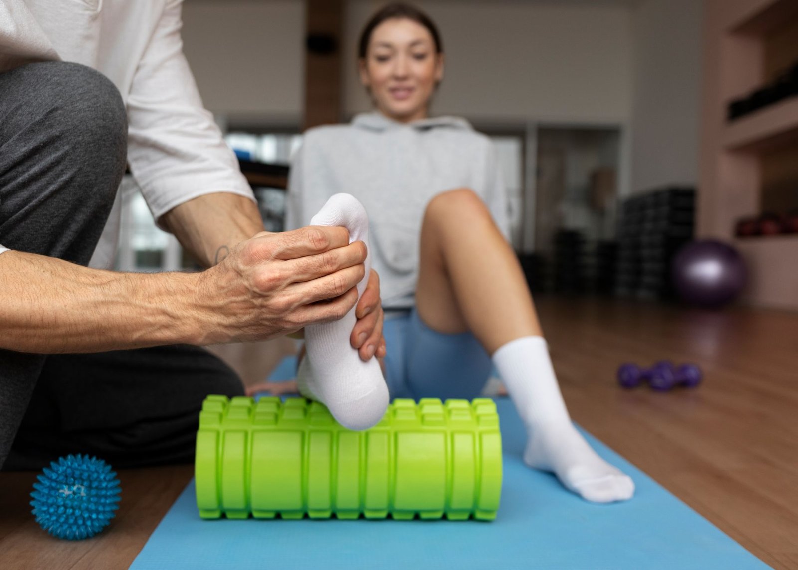 patient doing physical rehabilitation helped by therapists 1
