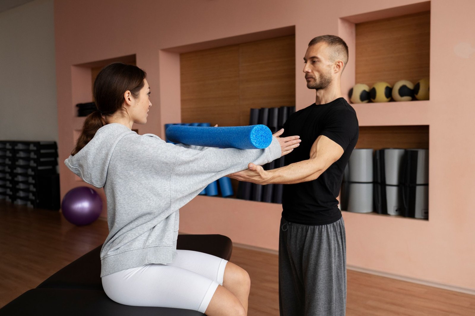 Patient Doing Physical Rehabilitation Helped By Therapists 2