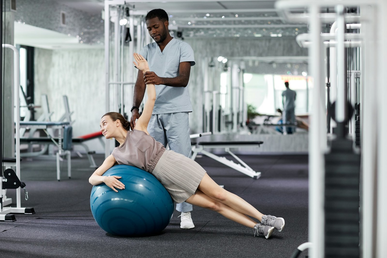Young Woman With Physio Therapist